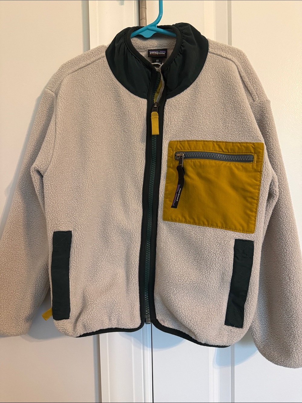 Patagonia Kids Cream Fleece Jacket with Mustard Pocket and Dark Green Trim